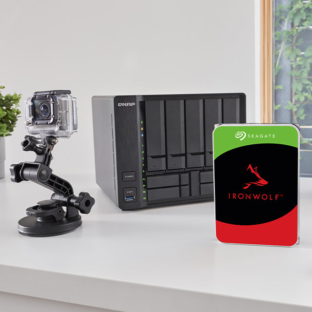 A photo of a multi-bay NAS system with an IronWolf drive and small form camera.